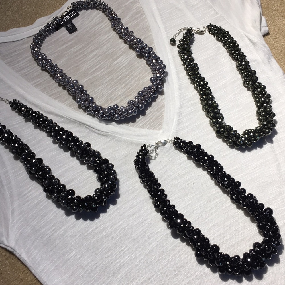 Pearls.  Black, black/gray, silver, olive green